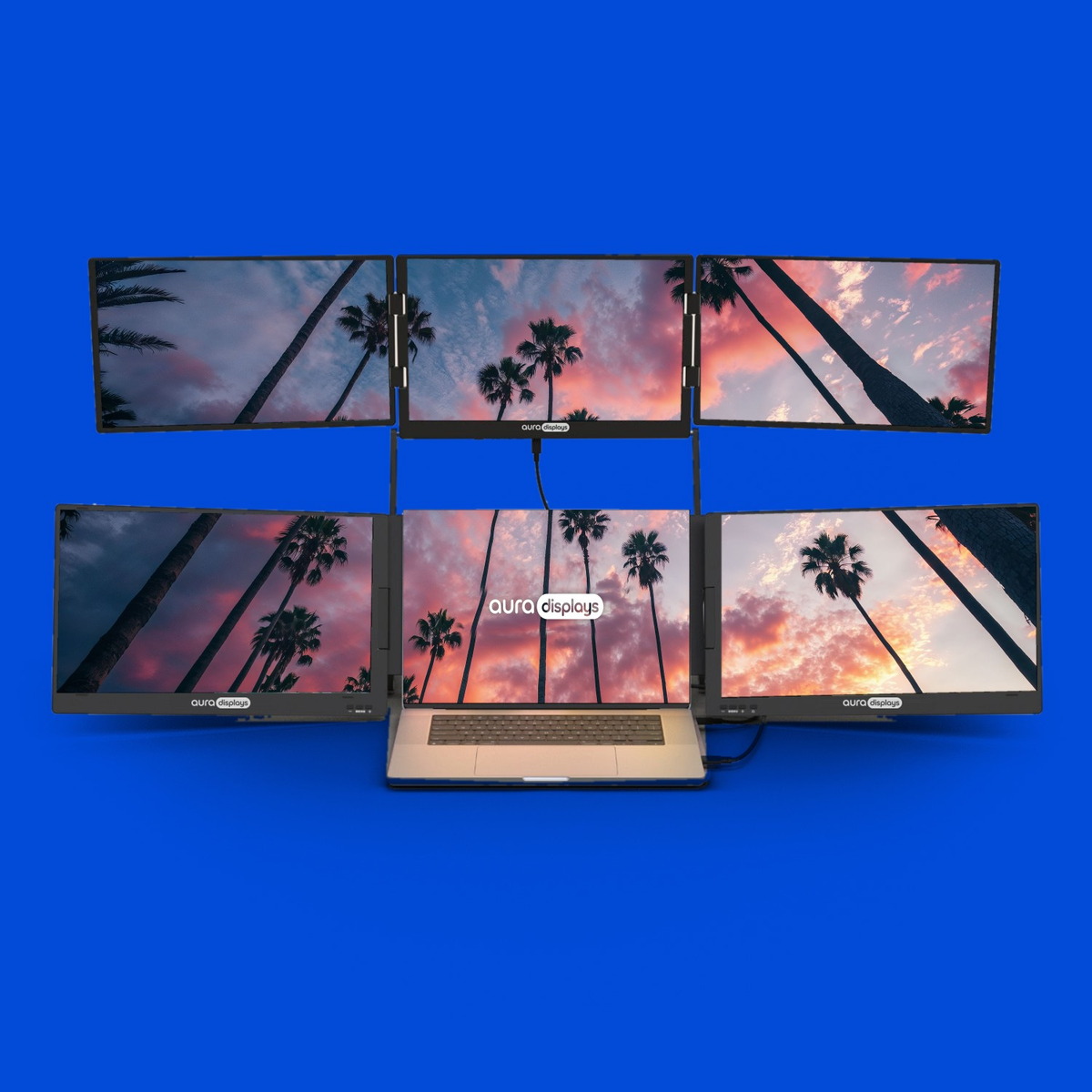 Los Angeles wallpaper shown across six Aura Displays screens with a laptop