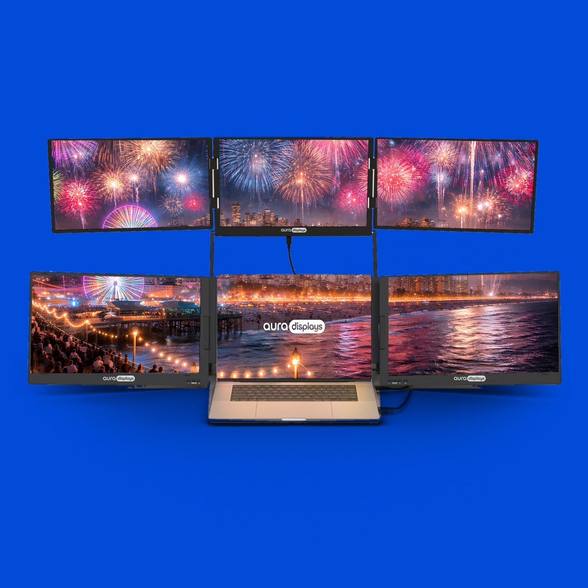 2026 Fireworks wallpaper shown across six Aura Displays screens with a laptop