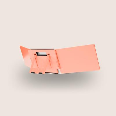 Orange folding stool on a light gray background